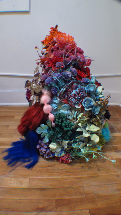 caitykennedy:flower trophy, floor presentation. fake flowers, paint, fake hair, glitter, stuffing…