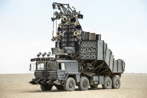 robotlyra:  streetsofnightcity:  Bow before the metal god of the post-apocalypse world of Mad Max, the Doof Warrior and his massive rock-blaring, ear-splitting, flame-throwing, metal-shredding, taiko-drummer-carrying machine of rock: the Doof Wagon. 