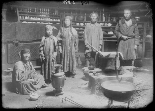 Khakas family inside their wooden yurt, Minusinsk, Russia, 1912 x