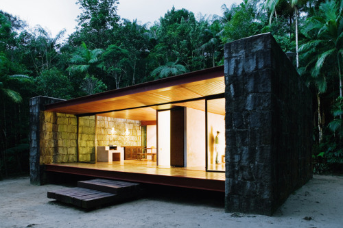 letsbuildahome-fr:  House in Rio Bonito by Carla Juaçaba Four steel beams puncture walls so as to allow a sliver of glazing to wash the interior of the stone walls with diffused light. The visual weight of the rustic stone counters the lightness of