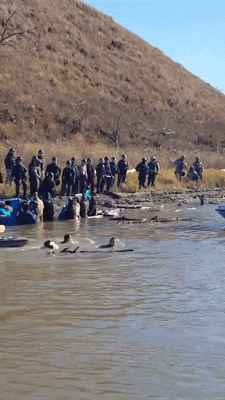 fancyladssnacks: gogomrbrown:   #NoDAPL protestors teargassed while standing peacefully in the water. US at their best - fight peaceful protestors with an army..    Share these images far and wide, especially since it’s Thanksgiving week. 