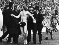 obscenewasteofbandwidth:  Streakers, gonna streak.  So anyone notice that this is really proof that we live in a different time now? Look at the streaker, he looks so unimposing. Most of the officers are smiling or look slightly amused/curious and seem