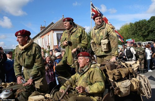 WW2 re-enactors cross Pegasus Bridge in their jeep