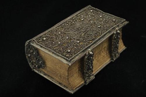 historyarchaeologyartefacts:1690 book with filigree silver binding, housed in the National Library o