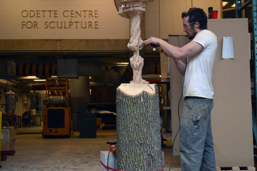 a-banana-named-anna:itscolossal:A Large Suspended Tree Trunk Carved Down to a Frayed Rope by Maskull