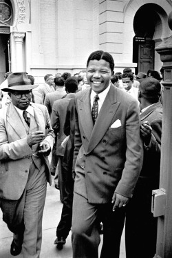 historicaltimes: Nelson Mandela walking free after his treason trial, 1961 via reddit 