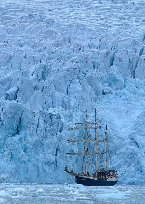 coiour-my-world:On the edge of the Ecumene ~ Barkentine Antigua in front of Emma Glacier (Emmabreen)