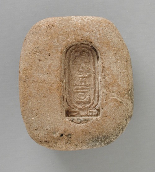 Terracotta mold with the cartouche of the solar disk deity Aten.  Artist unknown; reign of the 18th 
