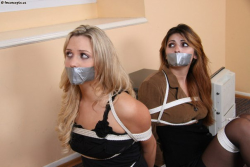 A match made in heaven! I think the robber left behind the real prize: two fucking gorgeous secretaries tied up and tapegagged.