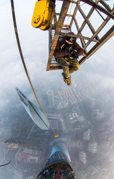 cjwho:Rooftoppers Secretly Climb 650-Meter-High Crane in Shanghai by Vitaly Raskalov and Vadim Makho