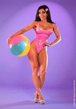 femalemuscletalk:  Latex muscle Barbie goes to the beach. Her name is Aya Sheryda  SHE LOOKS LIKE SHE TASTE DELICIOUS!