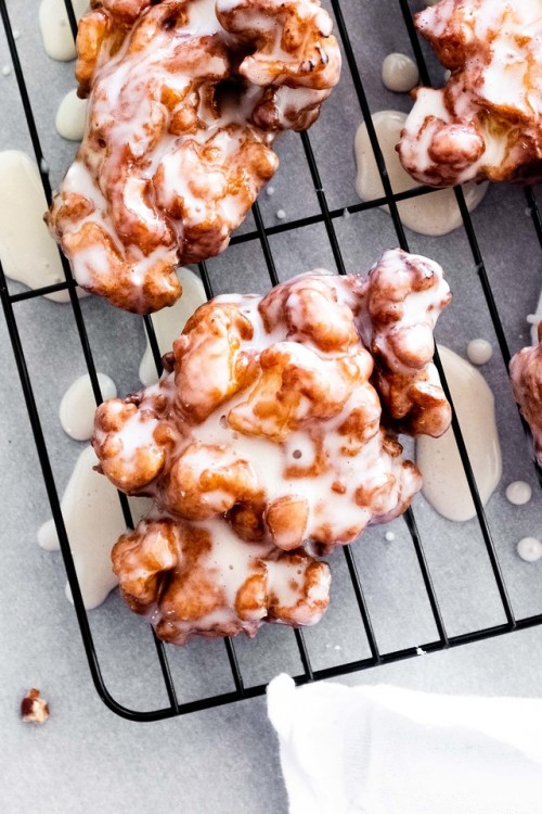 fullcravings - Warm apple fritters and a cup of coffee on a...