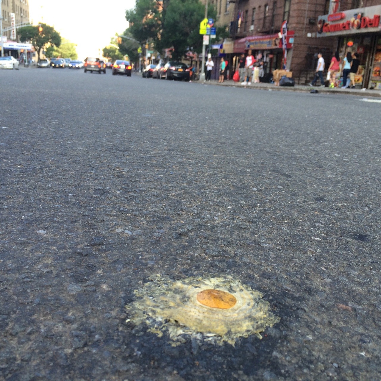 scoutingny:  Hot day in NYC - was someone literally trying to fry an egg on the street?