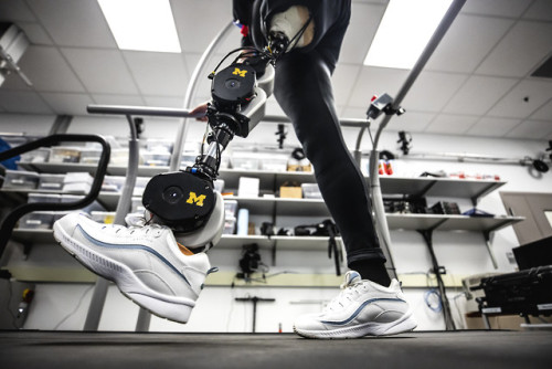 Dawn Jordan Musil tests an open-source robotic leg designed by Elliott Rouse, Assistant Professor of