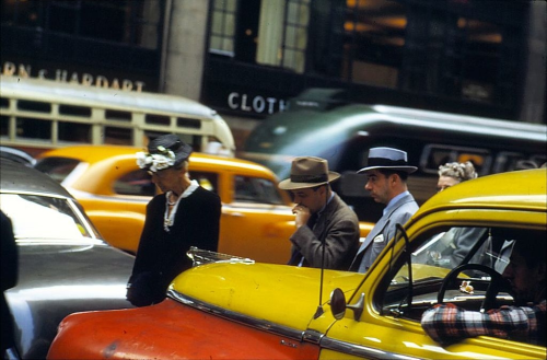 vintageeveryday:  Pedestrians weave their way through traffic, New York, 1953. Photographed by Ernst Haas.