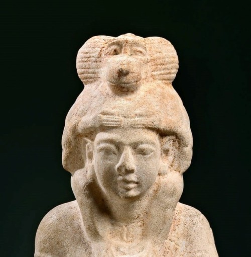 Statue of a scribe and priest of the god Thoth carrying a baboonFrom Ashmunein (ancient Hermopolis)N