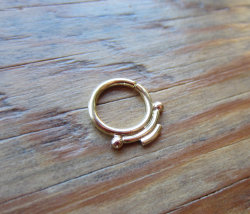 labretandnoseporn:  18k Yellow Gold Indigenous Seam Ring by aprilsblissed