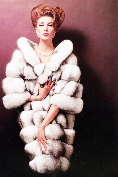 sharontates:   Wilhelmina Cooper models a fur coat, C.1950’s. Photo John Rawlings