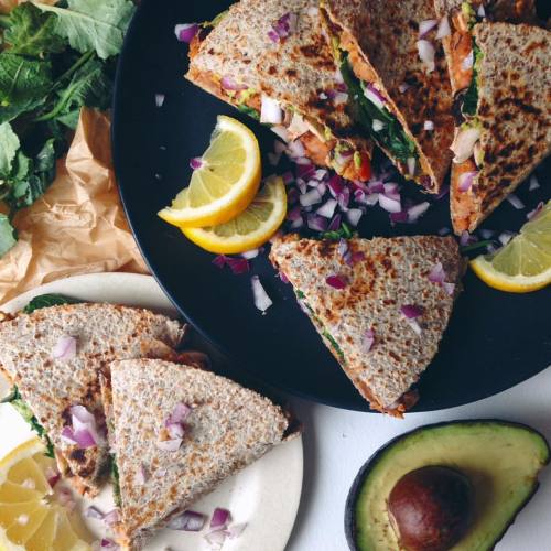 veganarchi:  Messy vegan quesadillas decked out with ALL the goods Homemade spicy refried beans, red