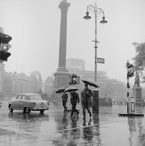 undr:
“ Moore/Stringer
Pedestrians struggle through Trafalgar Square, London, in the rain. 1962
”