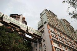 cgtnofficial:  Not your average “hole in the wall”   Believe it or not, for residents of one building in China’s Chongqing municipality, that dull rumbling noise is actually a train. According to Guangming.cn, the train passes through the complex