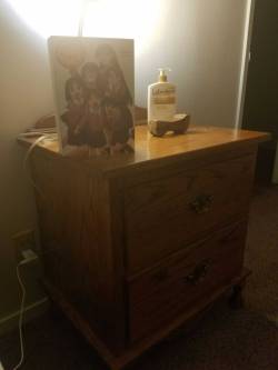 A bedside table, and a book.  This place is a mess, but the presence of actual furniture makes it home.  (Here&rsquo;s hoping I&rsquo;ll get some money back for that broken dresser leg, it now wobbles when I open the drawers D:)