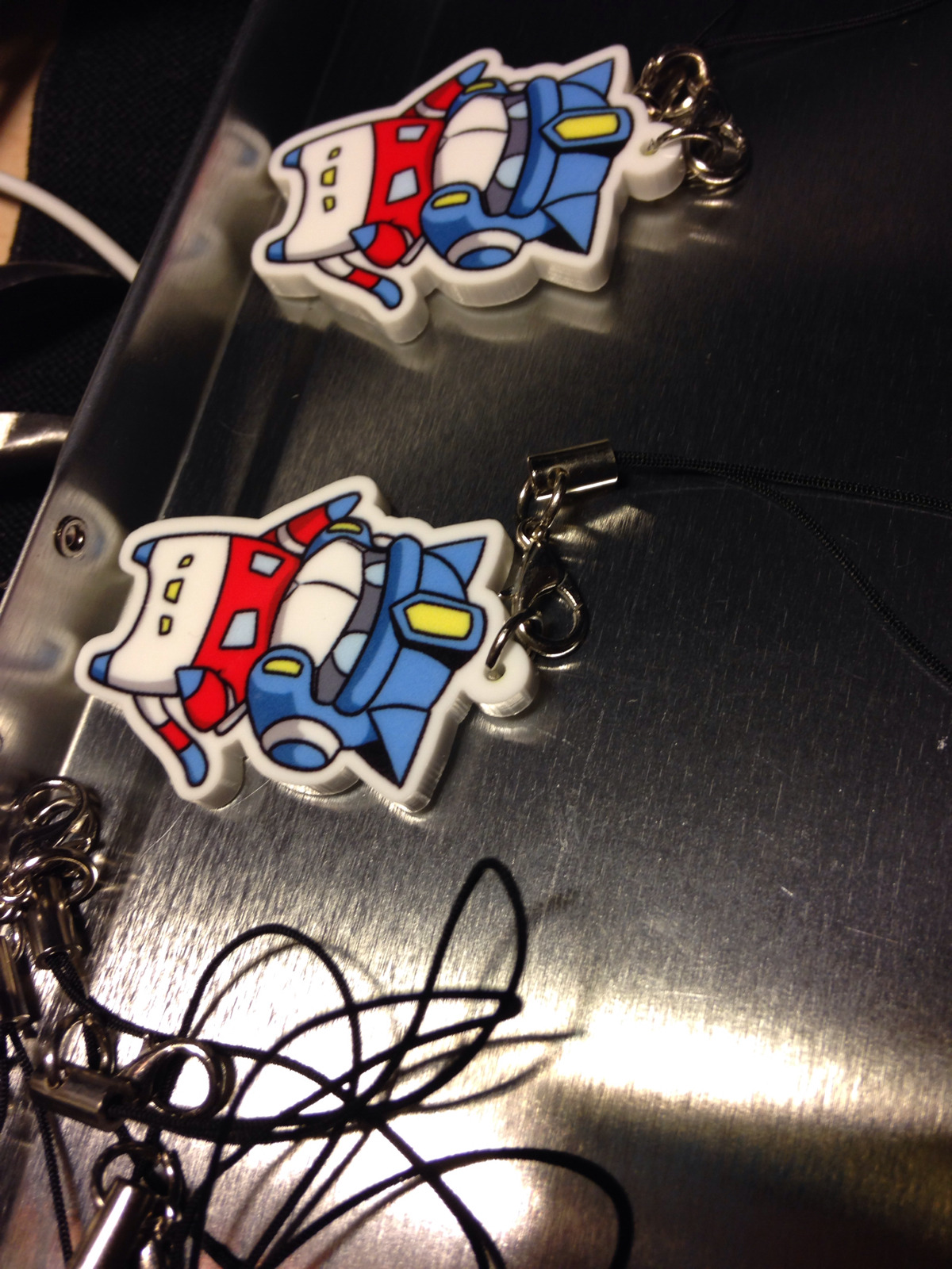 Adding a metal ring to these new batch of charms. Hopefully it&rsquo;ll make