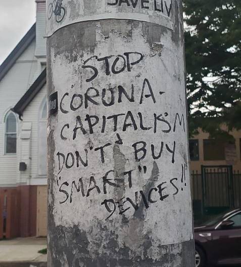 “Stop corona-capitalism. Don’ buy "smart” devices" Seen in Baltimore, MD