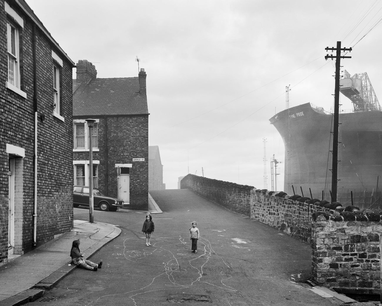 undr: Chris Killip. Looking east on Camp Road, Wallsend, 1975