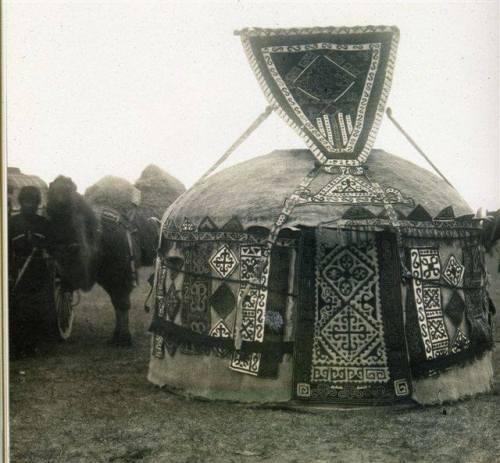 A traditional Nogai tent (nomadic Turkic people from the North Caucasus Region), circa 1920. Tent decoration with handwoven rugs.