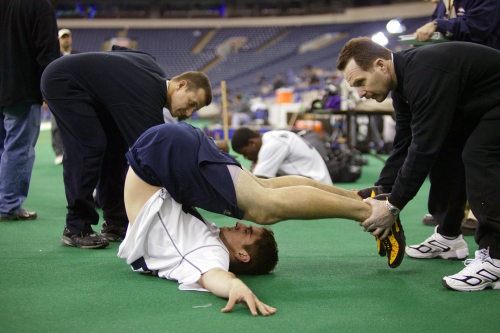 Aaron Rodgers does the flexibility test during the NFL Scouting Combine on Feb. 27, 2005 at RCA Dome