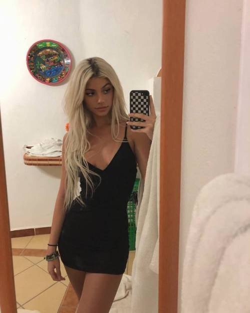 formmb: Smoking hot, long haired blonde in a tight, black mini dress. Love the long hair, spaghetti 