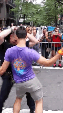 plutoh:  buzzfeed:  A Hot Cop Got Down At NY PrideThe purple-shirted dancer, Aaron