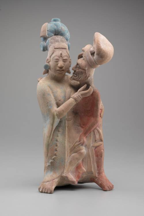 (via A painted Mayan figurine of an embracing couple made of terracotta. Made between 700 and 900 AD