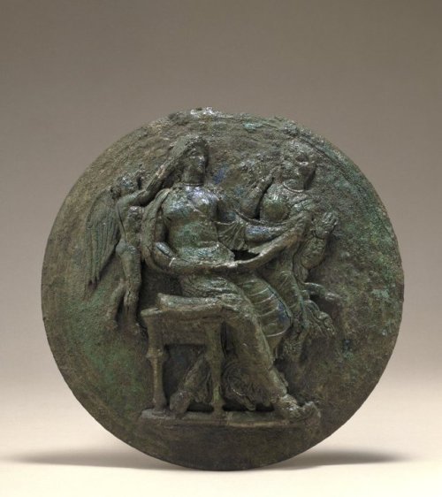 theancientwayoflife:~ Bronze mirror case with Aphrodite and Pan.Date: 380-370 B.C Place of origin: C