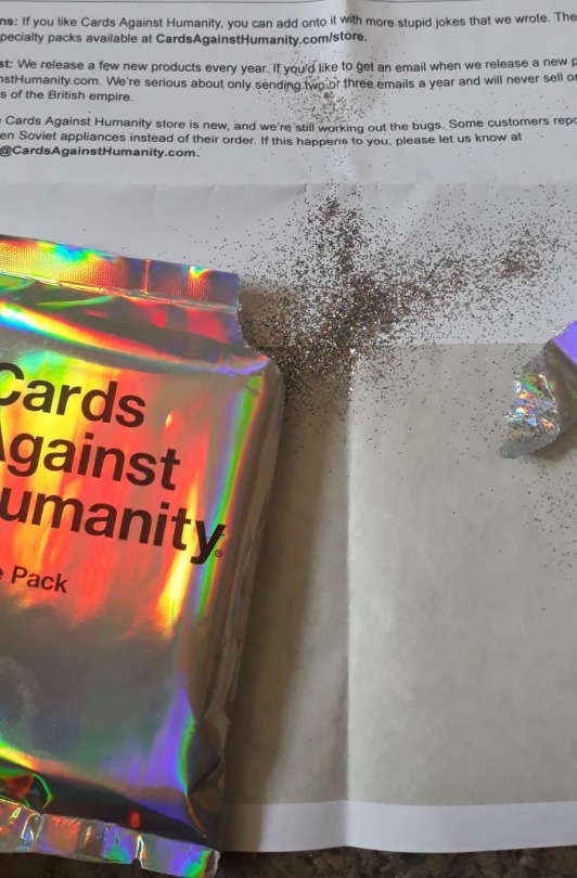 uristmcdorf: seshrat:  seshrat:  so the cah pride pack has options for buying it “with glitter" and “without glitter” and knowing cards against humanity they just tip like 3 tablespoons of fucking glitter into the pack of cards and send it