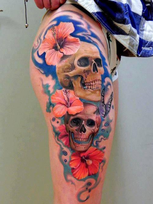 Flower skull thigh tattoo