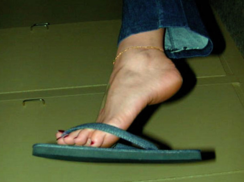 These flip-flops makes her feet very sweaty. Wanna smell?