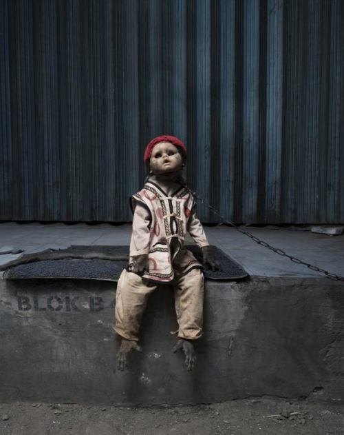 diablosita:  Perttu Saska - A Kind of You Street monkeys in Jakarta are trained and dressed as humans to ask for money to passersby, as is an old Asian tradition, these monkeys have now become real objects, even wearing doll heads to accent mimicry,