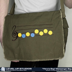 pwnlove:  Musical Hero’s Bag Break out the ocarina, Wind Waker, harp or flute to play your favorite Legend of Zelda tune off these new messenger bags from Level Up Studios. Each messenger bag comes with ten rubber song note pins so you can compose your