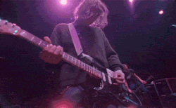 happy90syears:  Kurt Cobain Playing his Guitar.