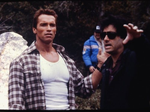 Mark L. Lester directs Arnold Schwarzenegger on the set of Commando.