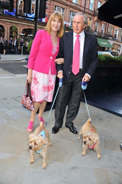Jackie and Helen Stewart share a red-carpet moment with their dogs, Pimms and Whiskey. Do note how J