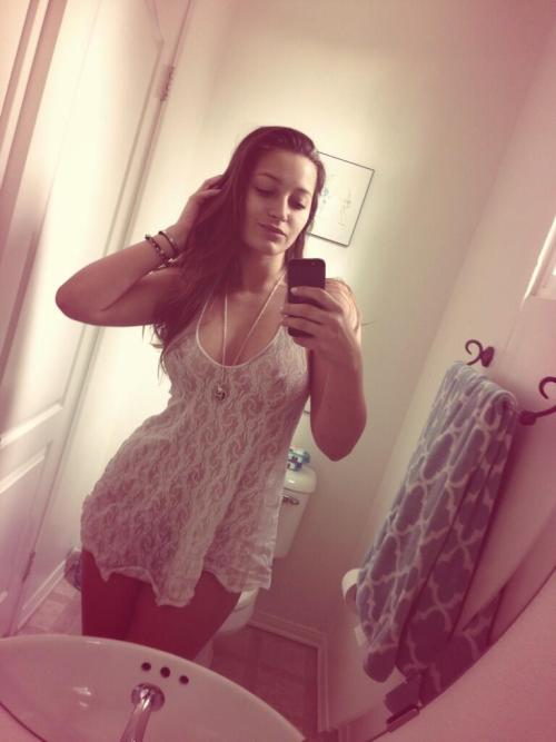 girl in white dress selfshot with phone Women in every ageTop Women