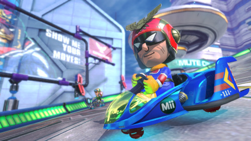 DLC trailer ends as Mario Kart 8 logo appears on screen. Captain Falcon walks out and falcon punches