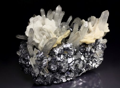 fuckyeahmineralogy:  Galena with Calcite flowers and Quartz; Krushev dol Mine, Oblast, Bulgaria
