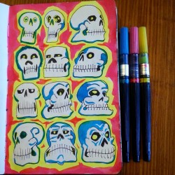 Adding color to previously doodled skulls.