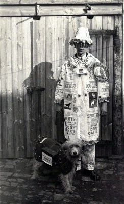 Portrait Of A Young Man In Fancy Dress Advertising Spratts Dog Cakes, Circa 1900.