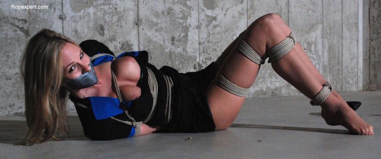 twentyties:  Aimee Addison helplessly bound and tape gagged.