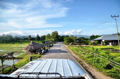 Riding on top of a bus through the Timor countryside. Read about the journey from Kupang to Dili on 